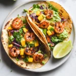 Spicy Shrimp Tacos with Mango Slaw and Avocado Crema