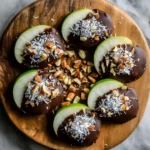 Chocolate-Dipped Apple Slices with Shredded Coconut, Toasted Nuts, and Seeds: A Quick, Healthy, and Elegant Treat