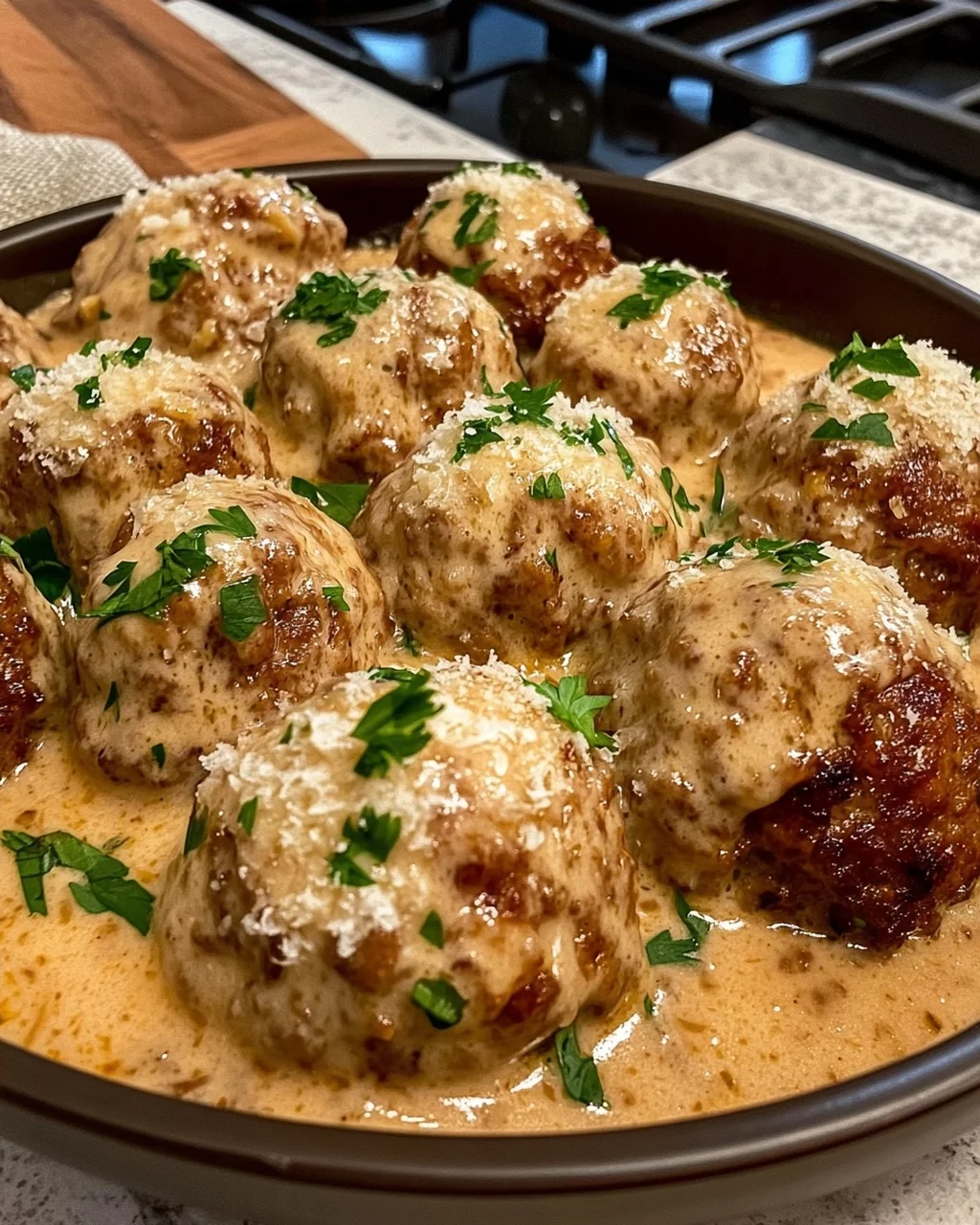 uicy Garlic Butter Meatballs in Creamy Parmesan Sauce.